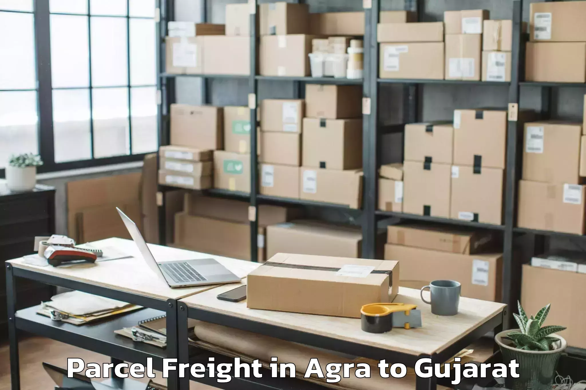 Book Your Agra to Hansot Parcel Freight Today